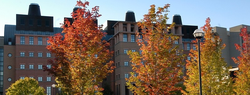 photo of engineer research center during the day with fall colored trees in the foreground