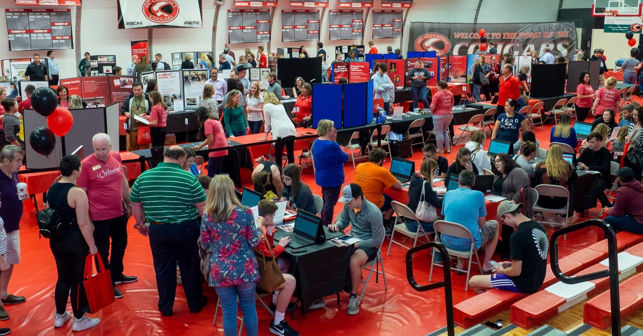 Students, parents, faculty and staff attend a UC open house.
