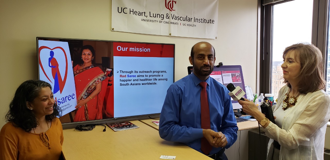 Lata Samu and Sathivel Sadayappan, PhD, shown with WVXU reporter Ann Thompson.