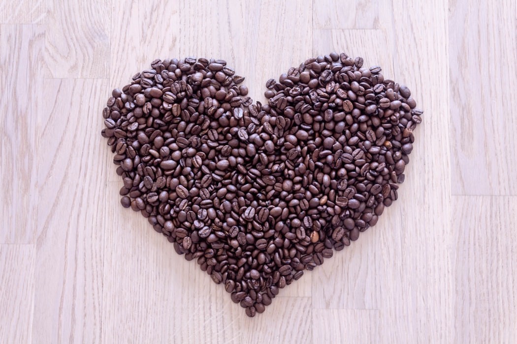 photo of coffee bean arranged in shape of a heart