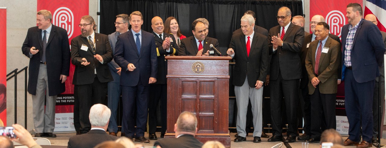 UC, state and military officials at the podium after announcing the opening of the Ohio Cyber Range Institute 