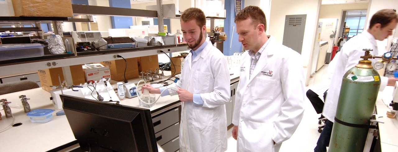 Kevin Haworth, PhD, shown with colleague in his laboratory