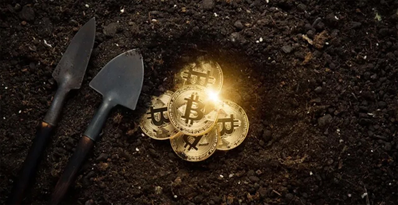 stock image of a shovel and gold coins