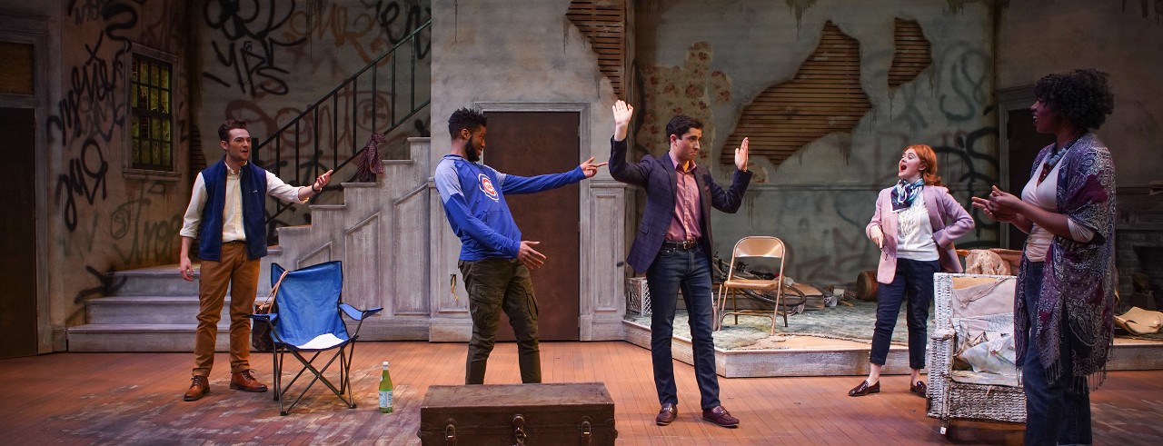 Actors on stage laugh in a scene for CCM's "Clybourne Park."