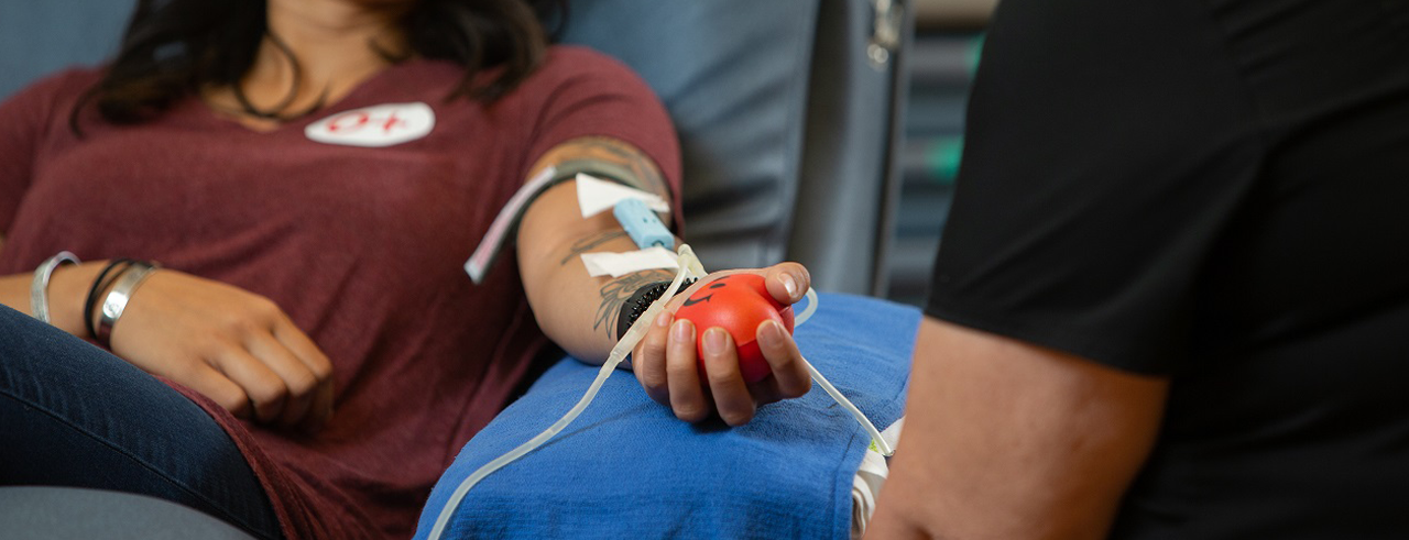 Close up of a woman's arm during a blood donation