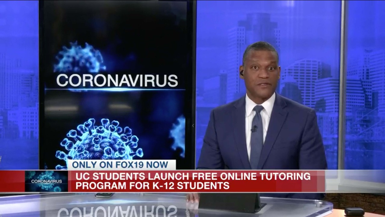 FOX19 anchor discusses the tutoring service with a coronavirus banner behind him and a chyron that reads UC students launch free online tutoring program for K-12 students.
