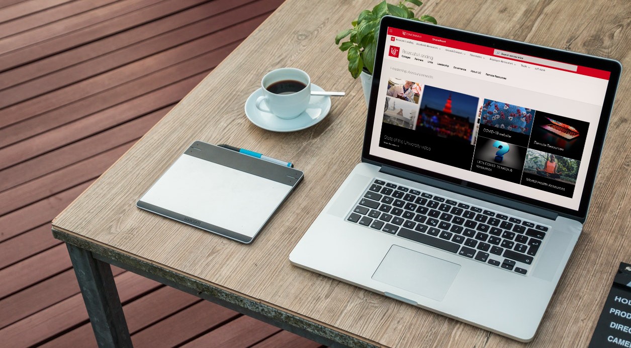 Laptop computer on a desk displaying Bearcats Landing hompage