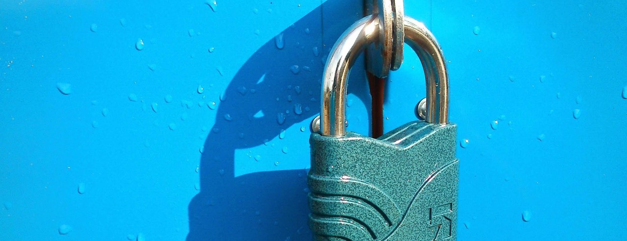 Green padlock on a blue object