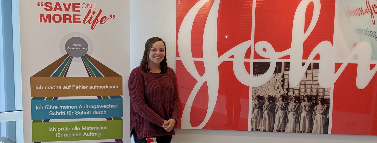 UC engineering student Charley Goodwin next to Johnson and Johnson sign