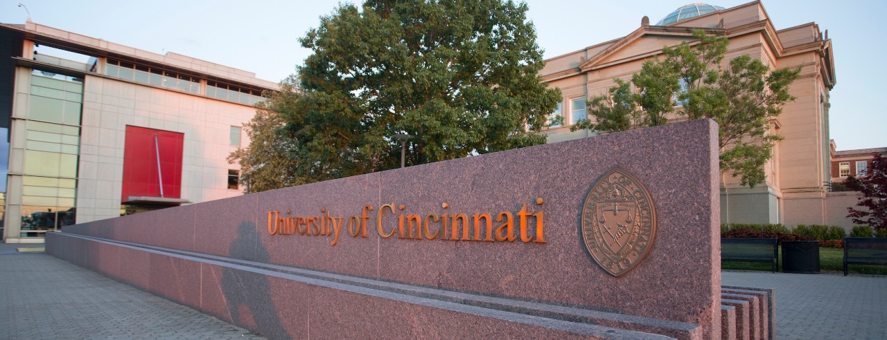 UC sign and water feature in front of University Pavilion on campus