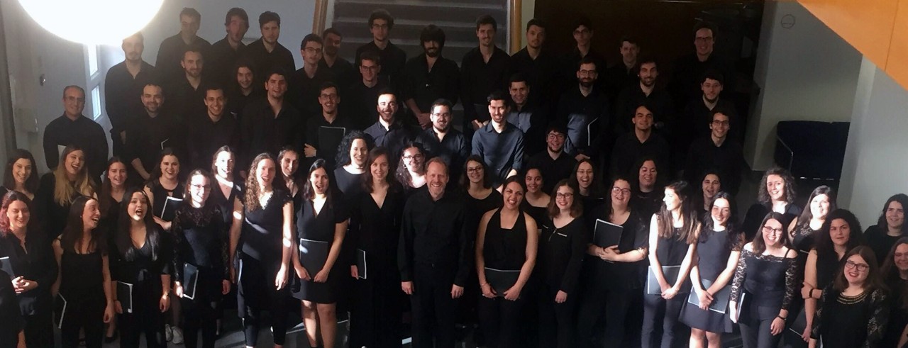 A choir poses for a group photo