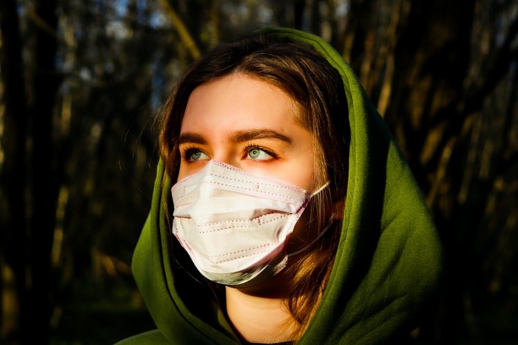 woman wearing a surgical mask