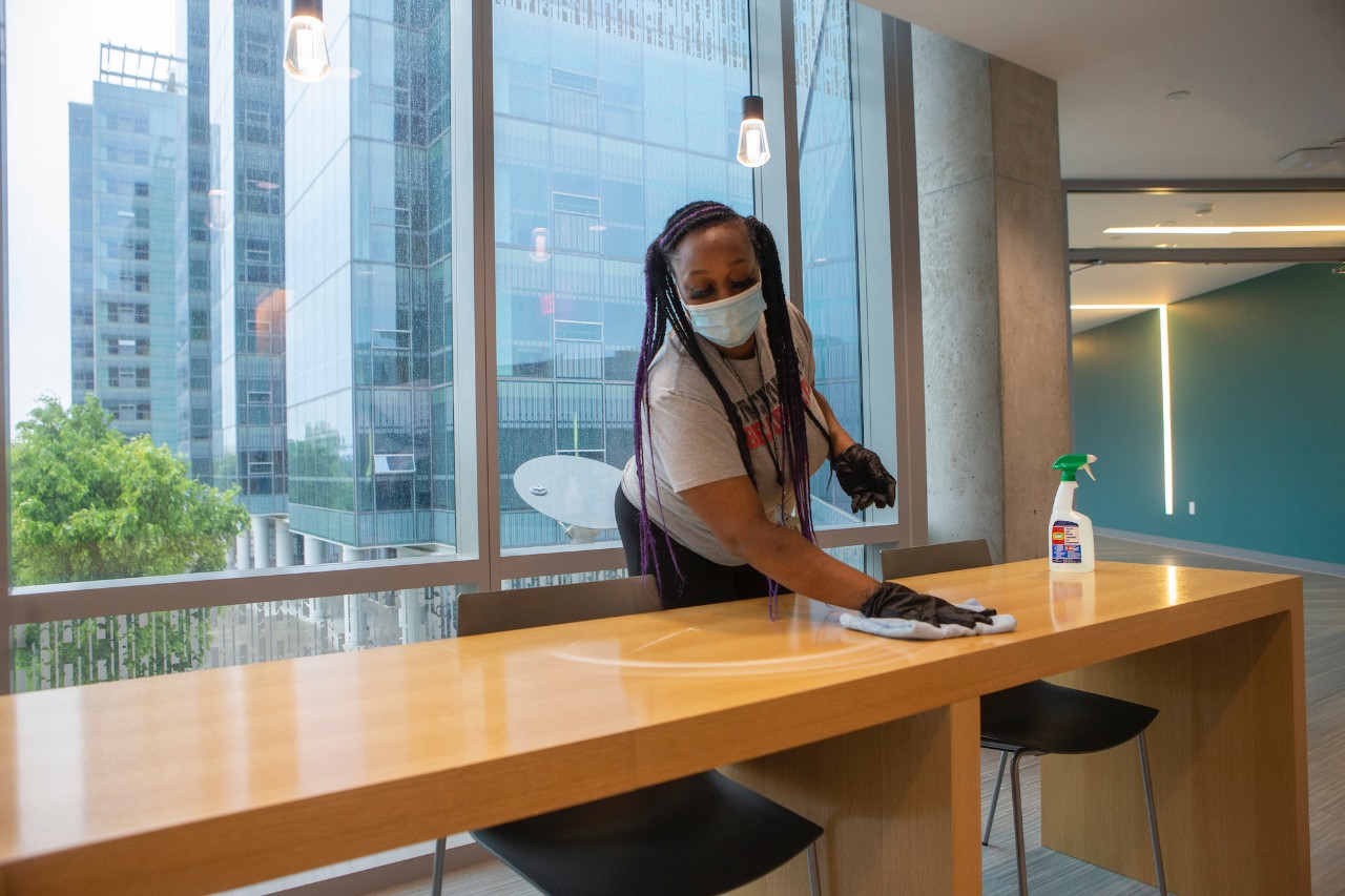 Custodian cleans table