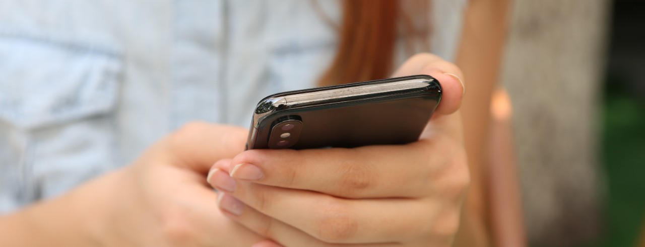 Person holds smartphone