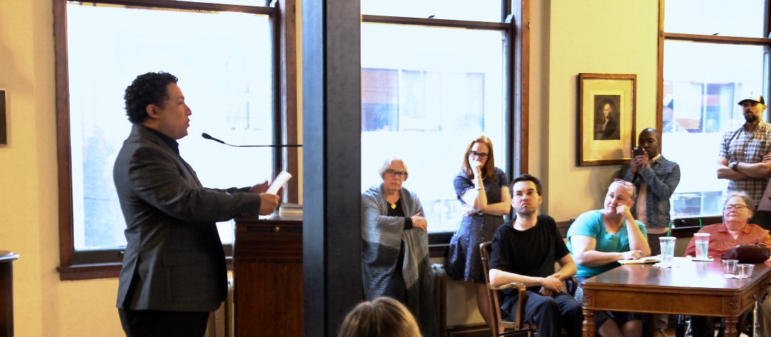 Manuel Iris gives a public reading.