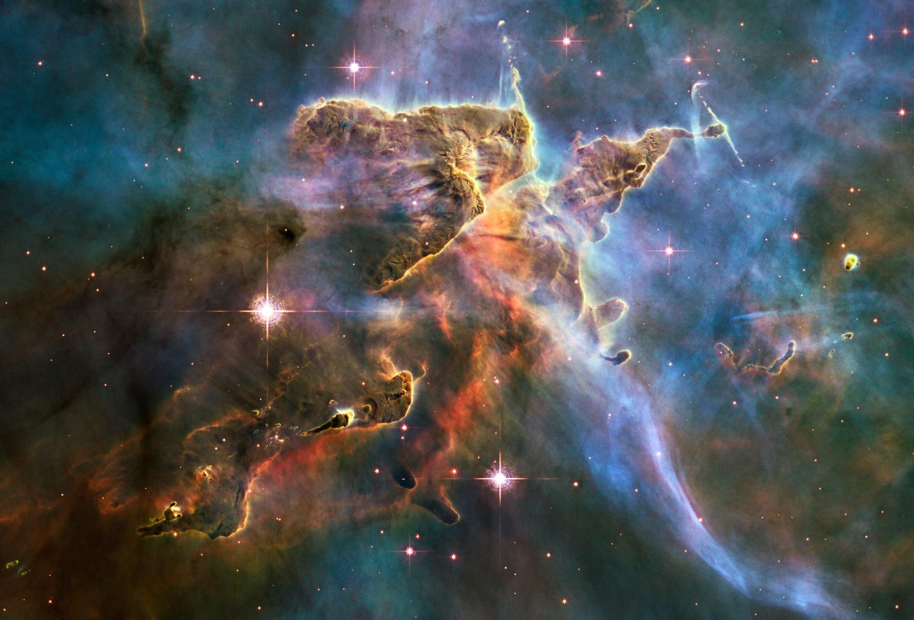 A cloud of interstellar gas billows around the Carina Nebula captured by NASA's Hubble Space Telescope.