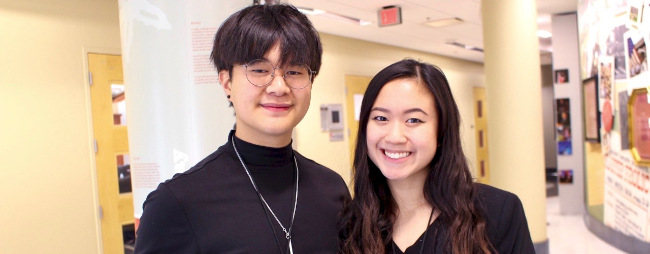 Vietnamese man and woman stand together at UC.