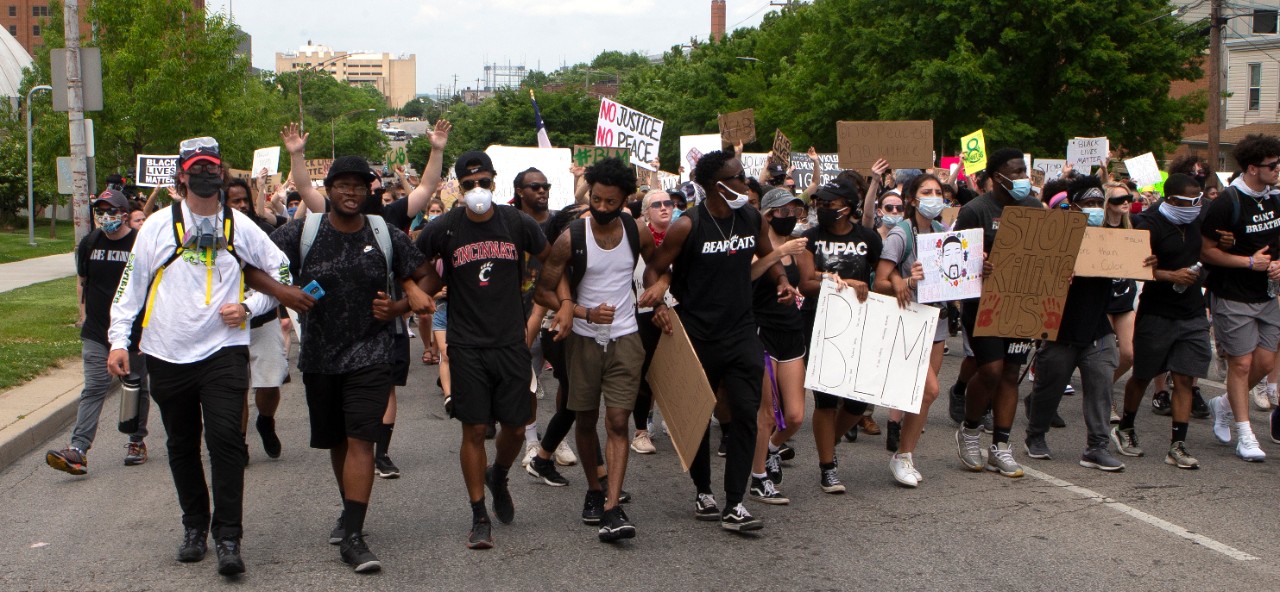 Large group of students protest in street