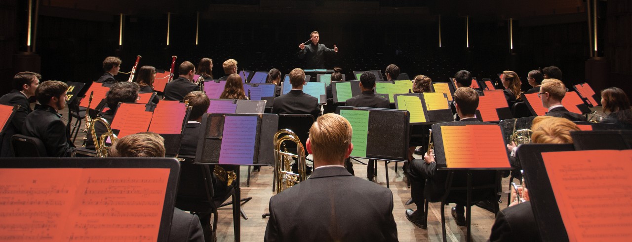 Musicians on stage during a rehearsal