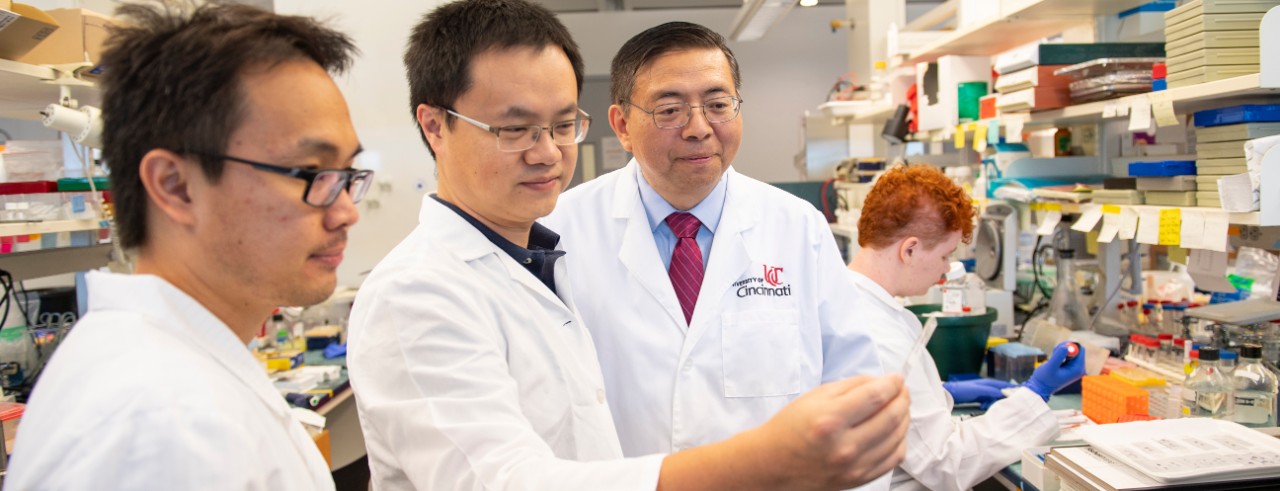 Jun Lin Guan with members of his lab