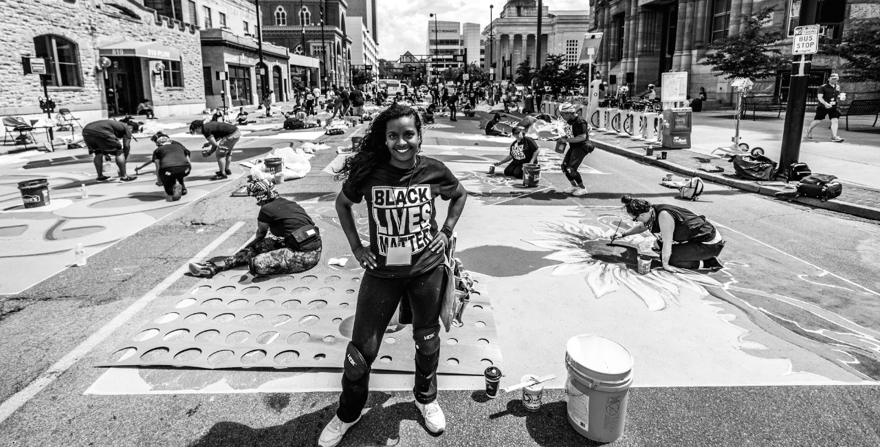 Adora Maxberry, a UC student helps with the Black Lives Matter mural in downtown Cincinnati.