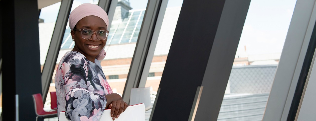 Halimat Olaniyan stands on UC's campus.