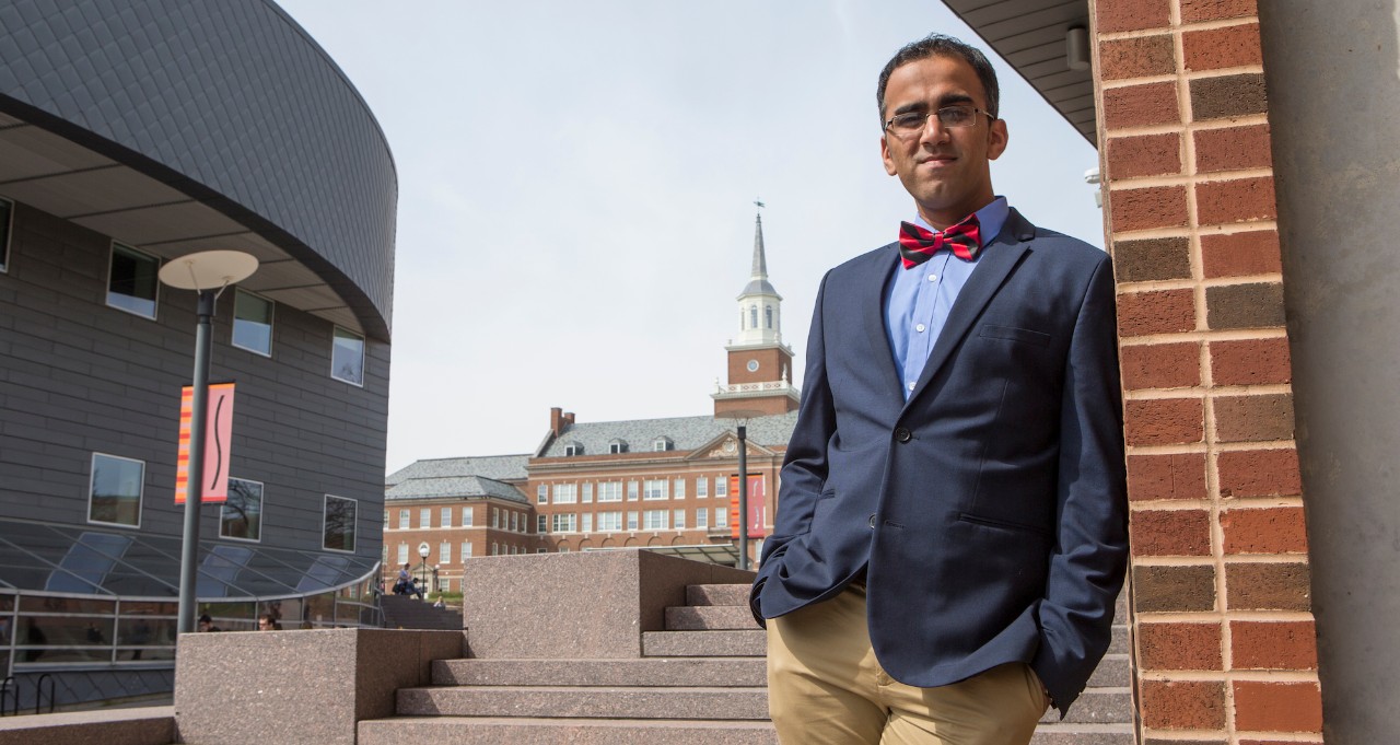 Sid Thatham stands on UC's campus along MainStreet.