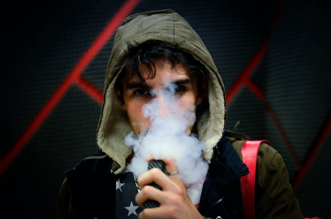 image of male vaping