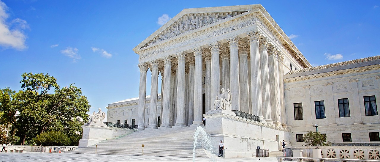 Large marble courthouse on a blue sky day