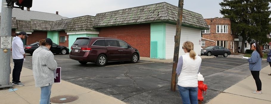 people standing in front of a clinic 