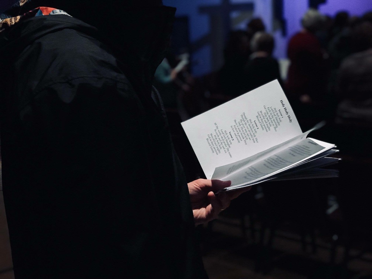 church goer with hymnal 