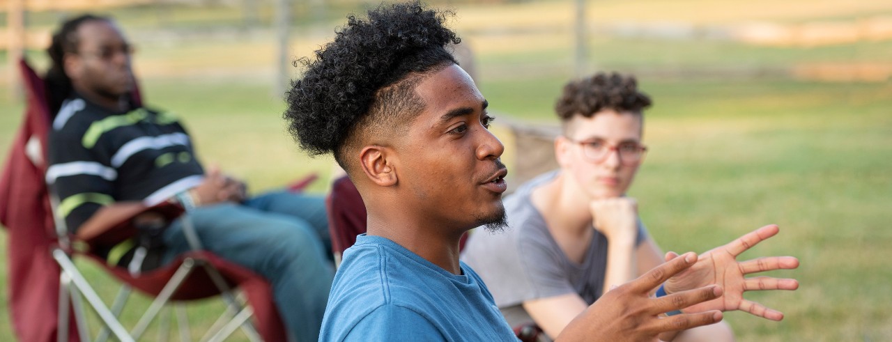 UC student Kenny Lyle attending fireside chats on race and diversity.