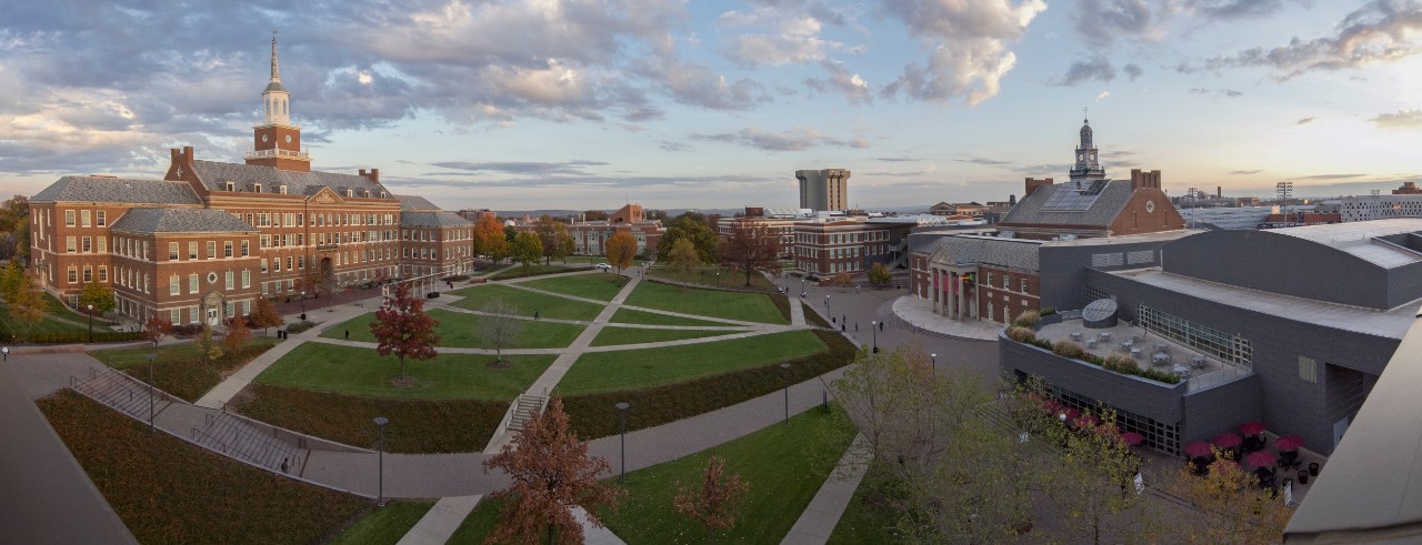 Sun rises on UC's campus shedding light on Tangeman University Center and green space