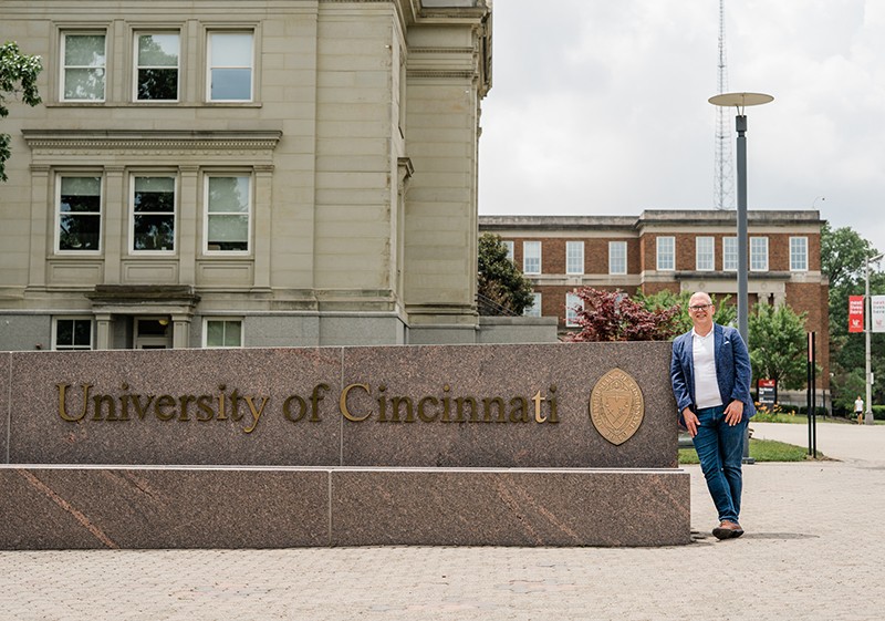 Jim Obergefell poses by UC sign on campus