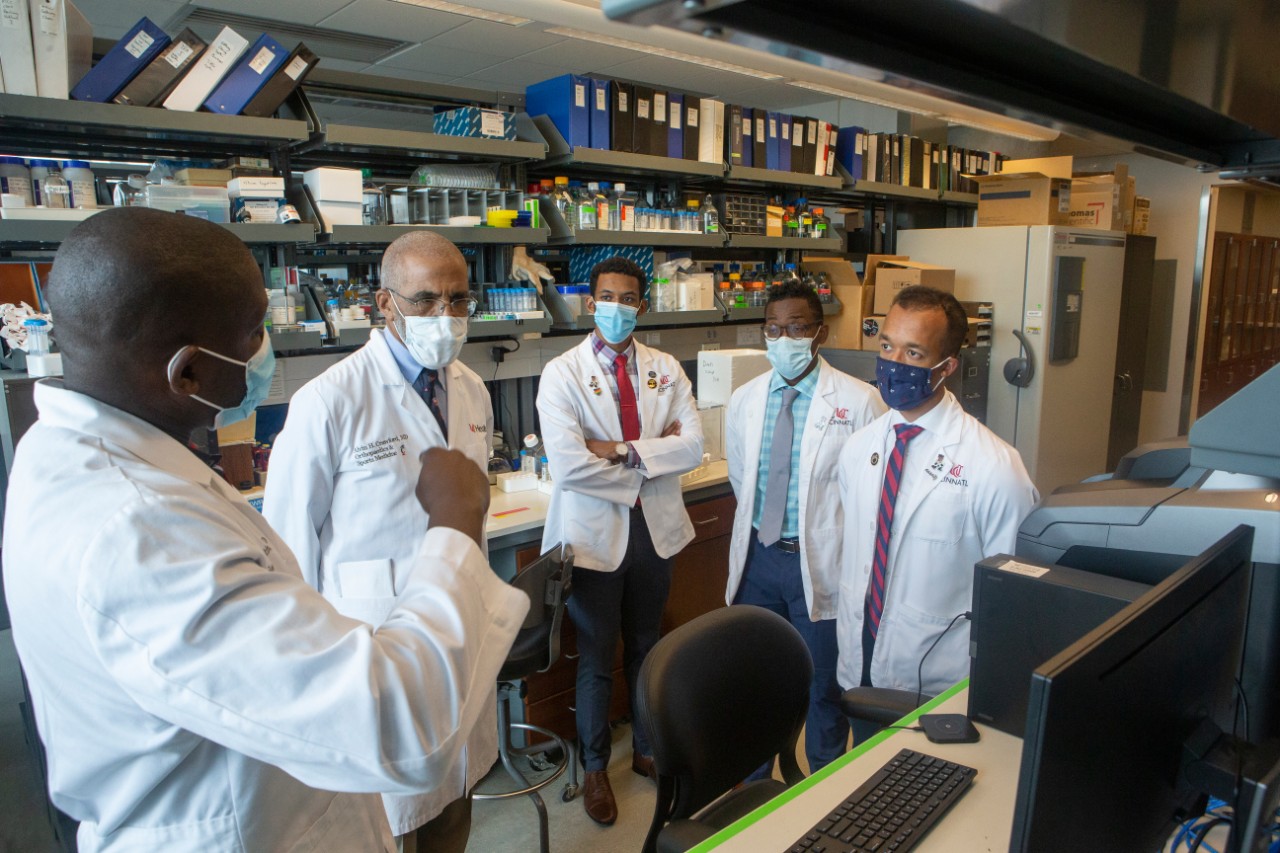 Doctors talk in a lab