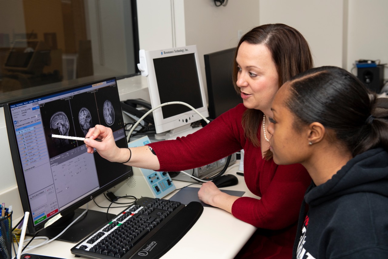 Speech-Language Pathology Student with Professor looking at scans