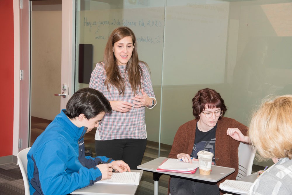 Maria Ortiz in a classroom with students