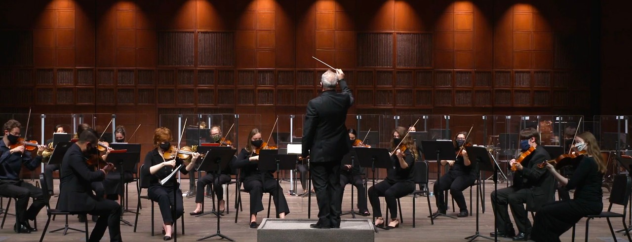 The CCM Philharmonia student orchestra performs on the stage of Corbett Auditorium.