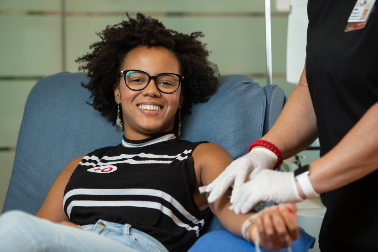 Young woman donating blood 