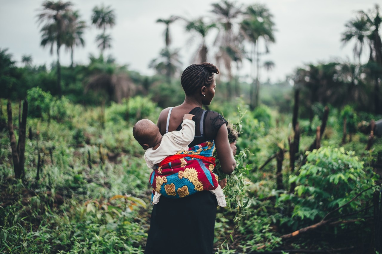 Africian female carrying a baby