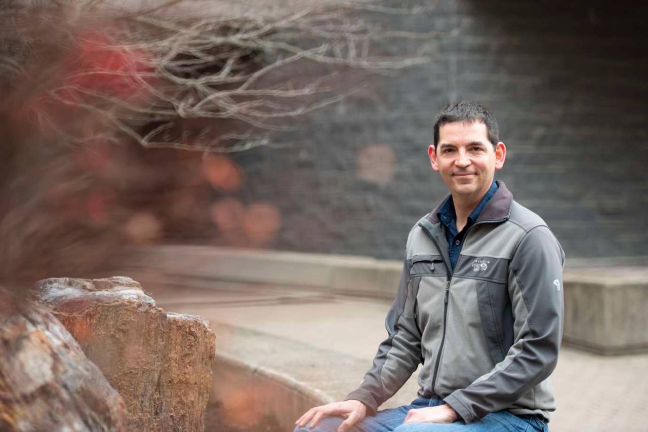 Joshua Miller poses on UC's Uptown campus