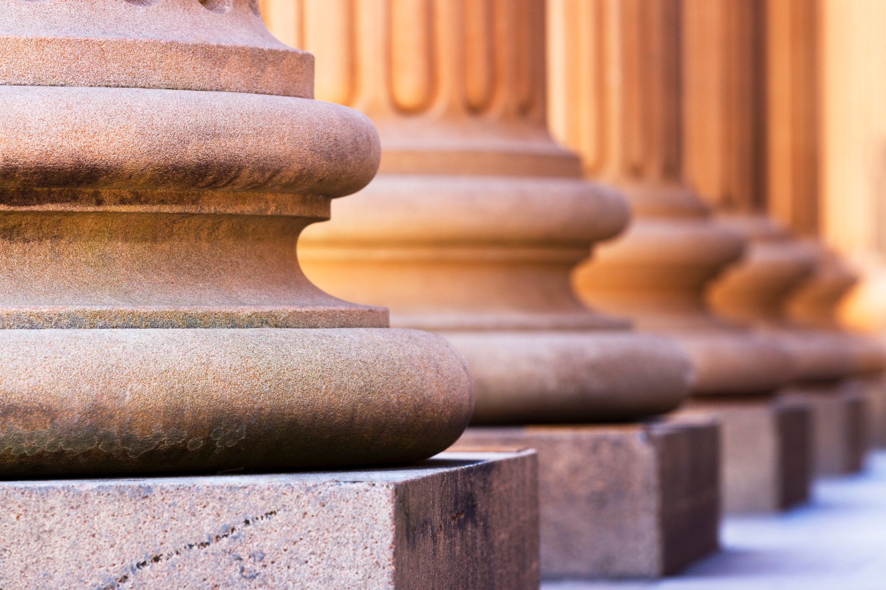 Columns outside of a courthouse.