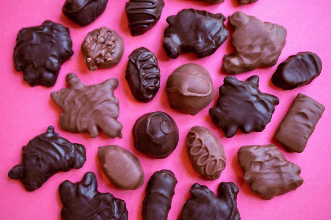 Chocolate candies on a pink background