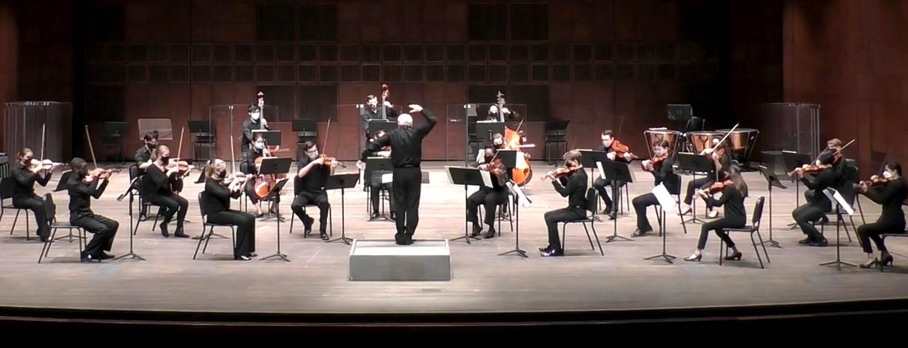 The CCM Philharmonia student orchestra performs on the stage of Corbett Auditorium.