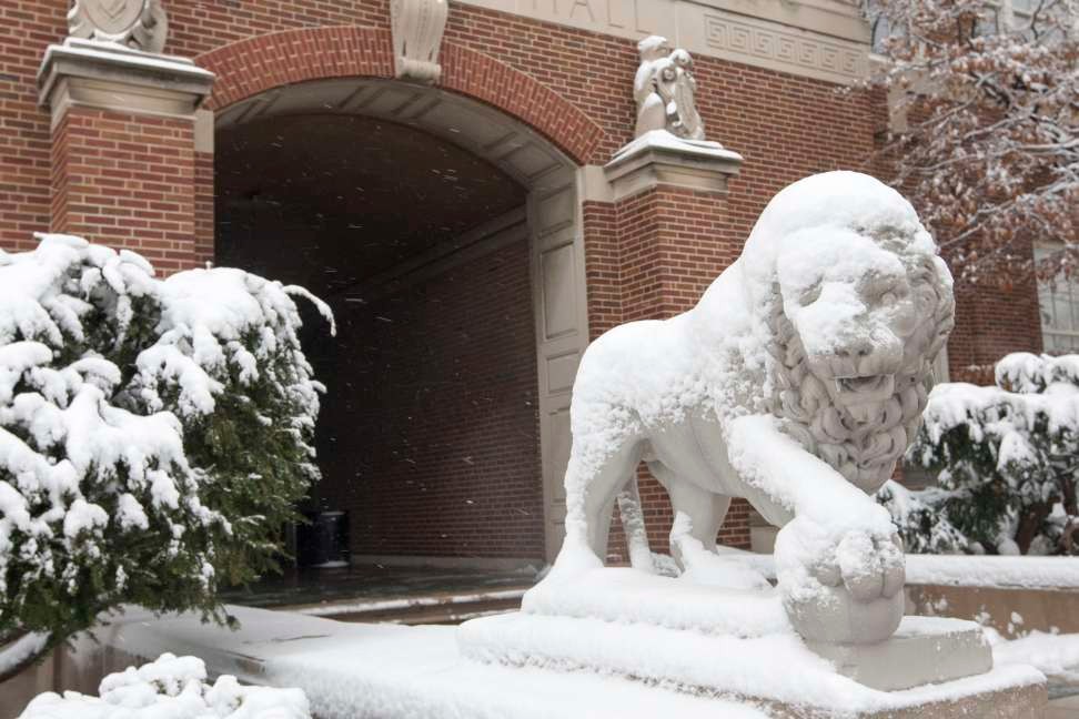 Snow covers the Mick and Mack statues on UC's Uptown campus.