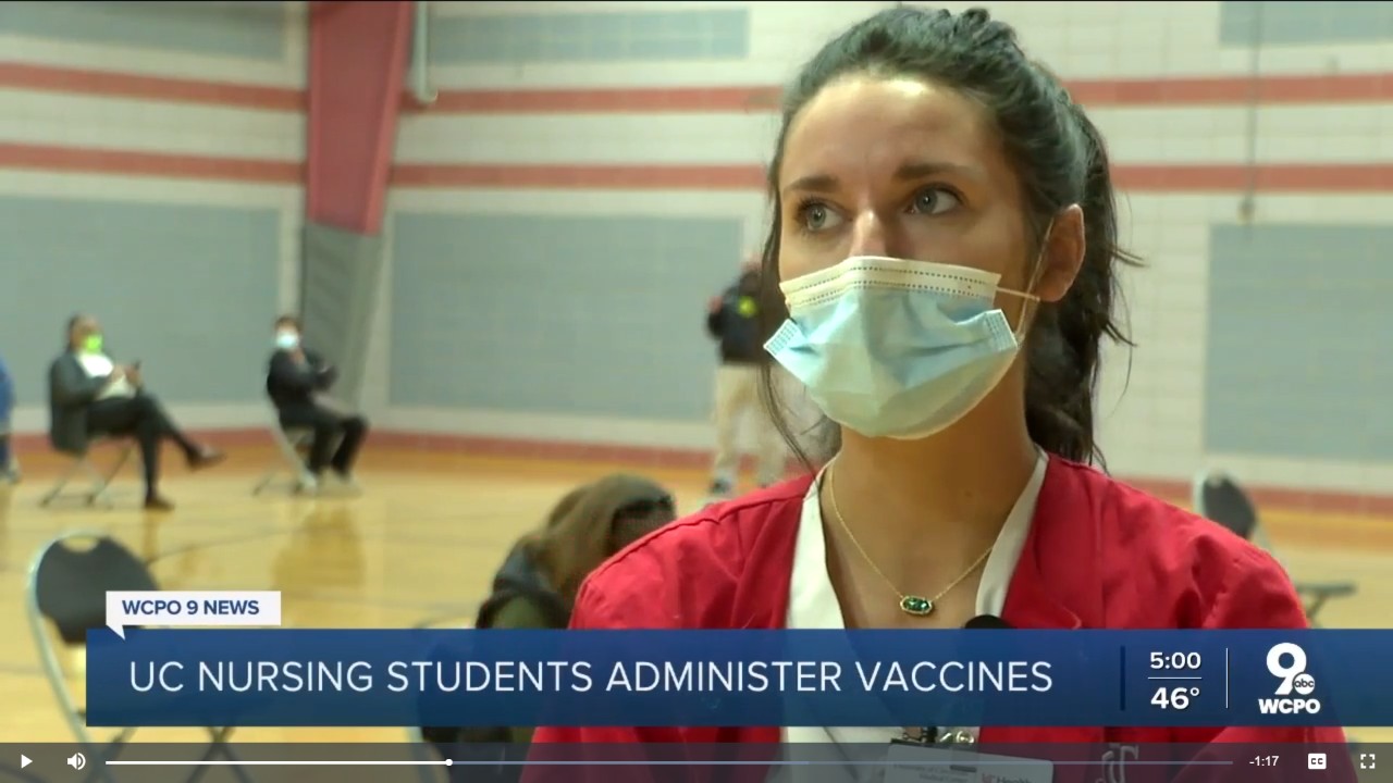 A screenshot of nursing student Jillian Vittetoe being interviewed by a local TV station while working at a COVID-19 vaccination site