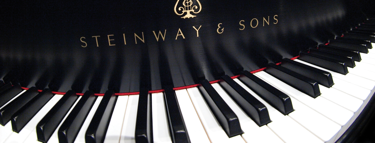 A photograph of the keyboard on a Steinway piano.