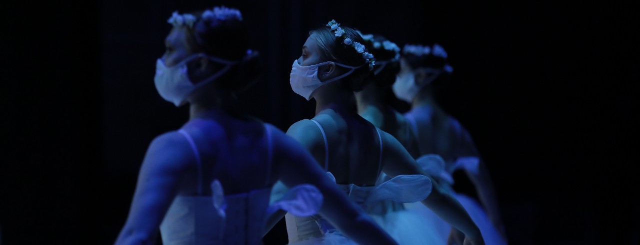 Dancers preparing for the Travelogue performance