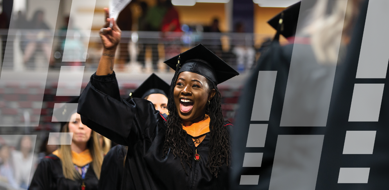 A student in her cap and gown at commencement