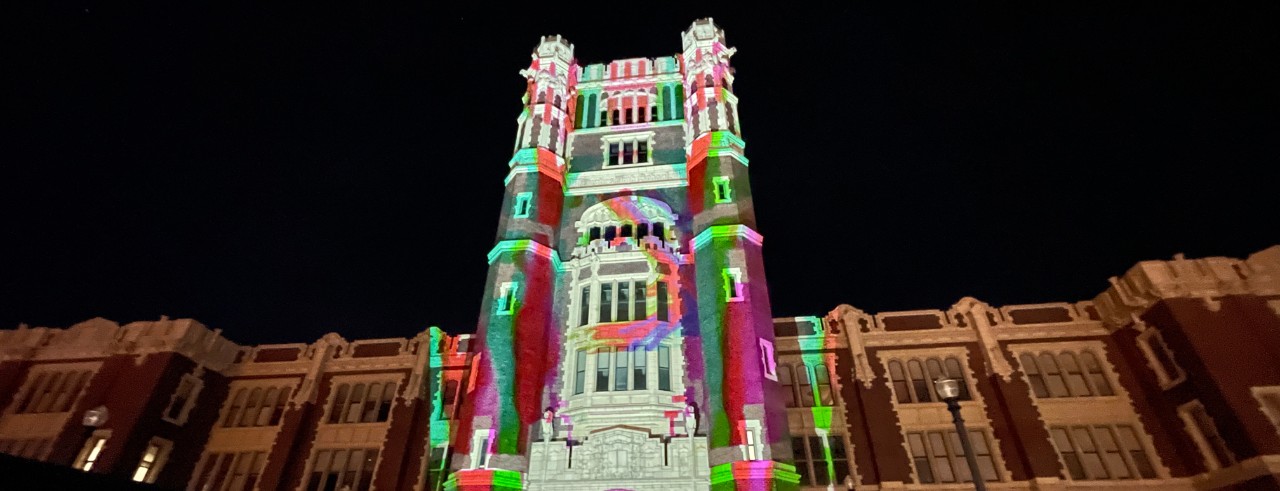 A colorful light show projected onto a building